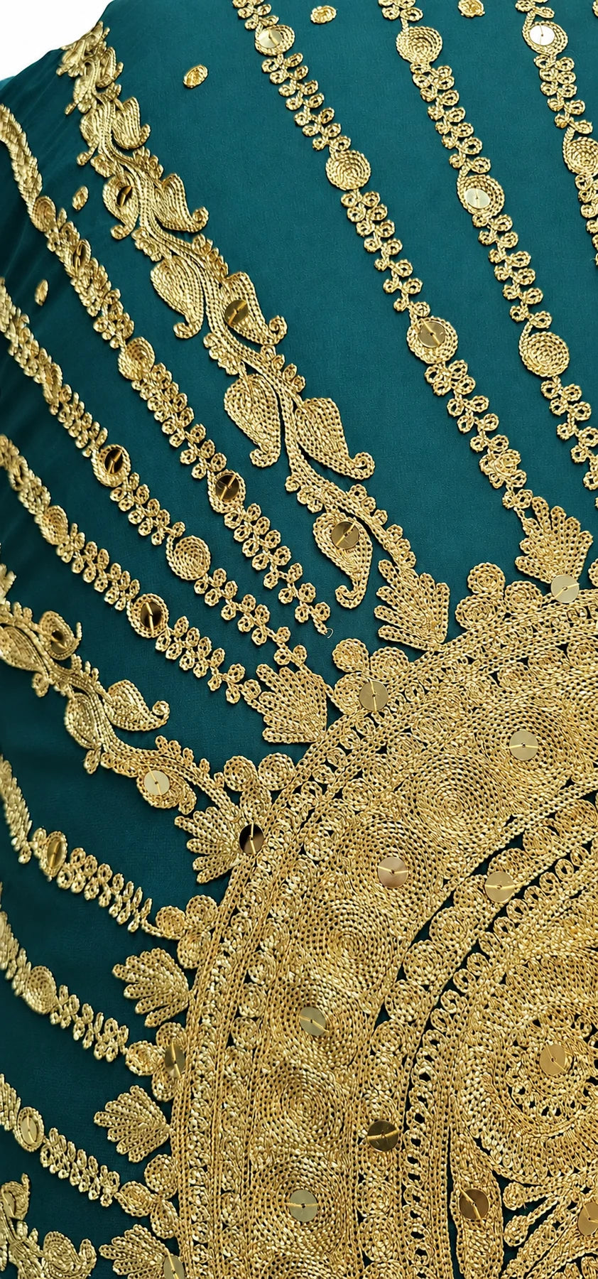 Close-up of gold embellishment on emerald bridal veil